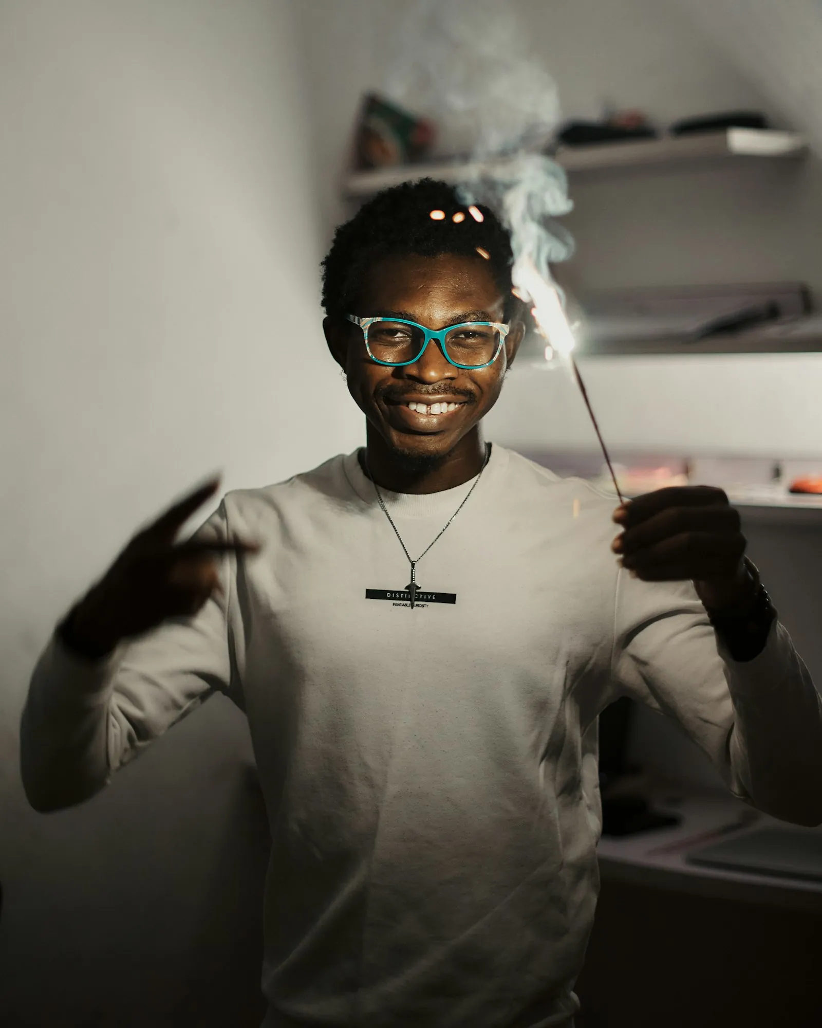 African worker with welding sparks — civil and industrial works